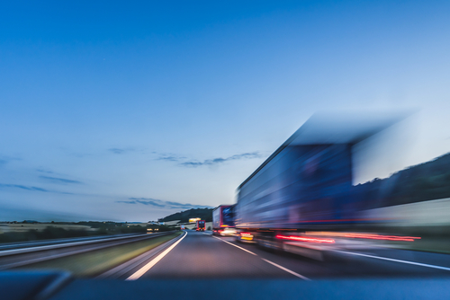 Background,Photograph,Of,A,Highway,,Trucks,On,A,Highway,,Motion